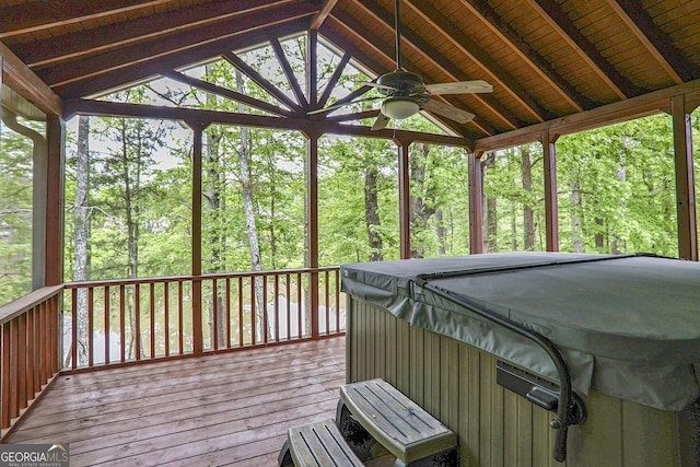 deck with ceiling fan and a hot tub