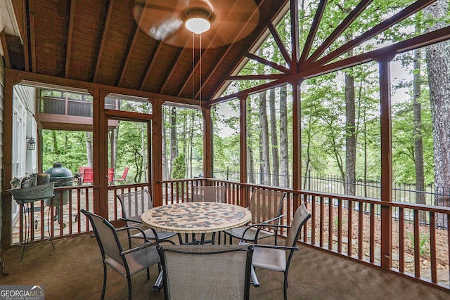 sunroom / solarium with outdoor dining area