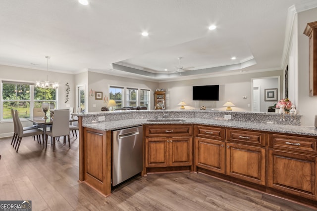kitchen with wood finished floors, ceiling fan with notable chandelier, dishwasher, and a wealth of natural light