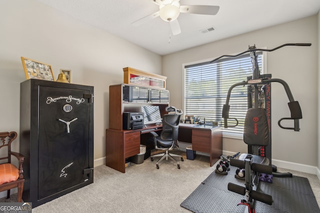 home office featuring baseboards, a ceiling fan, carpet flooring, and visible vents