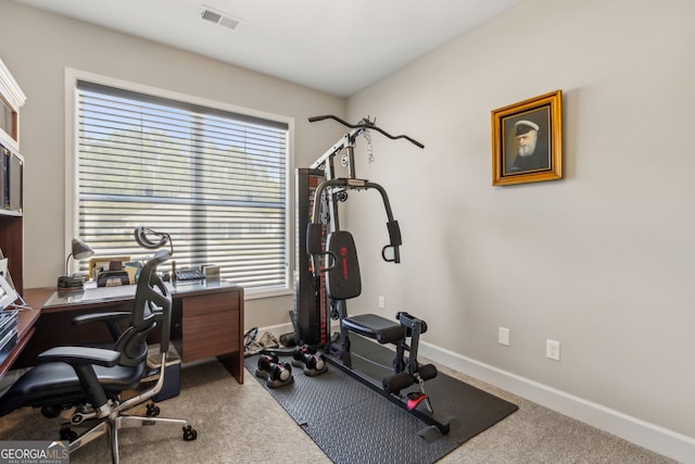 workout room featuring carpet flooring, baseboards, and visible vents