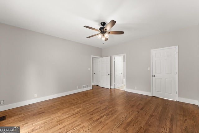 1155 Springway Dr, Gainesville, GA 30501 - unfurnished bedroom featuring baseboards, visible vents, wood finished floors, and ensuite bath
