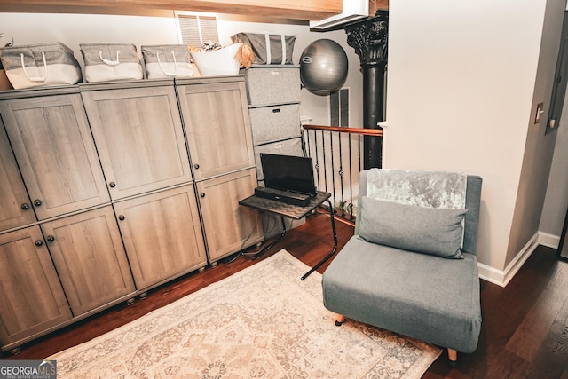 sitting room with baseboards, dark wood-style floors, and visible vents