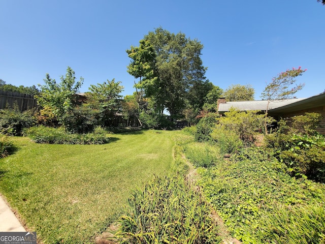 view of yard with fence