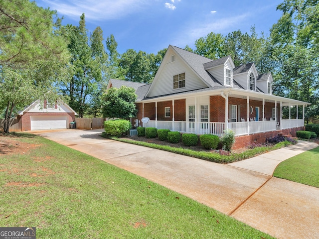 1302 Eddie Craig Ct, Mcdonough, GA 30252 - view of front of property featuring brick siding, a porch, a front yard, a shingled roof, and driveway