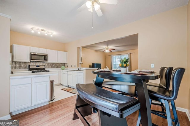 3746 Berkeley Xing, Duluth, GA 30096 - dining area with ceiling fan and light wood-style floors