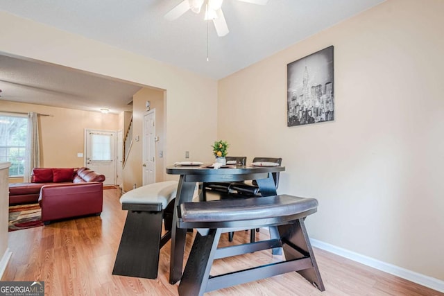 3746 Berkeley Xing, Duluth, GA 30096 - dining room featuring a ceiling fan, baseboards, and light wood-type flooring