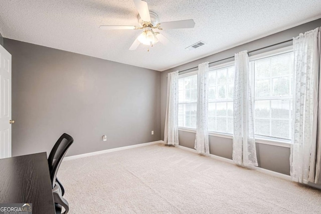 3746 Berkeley Xing, Duluth, GA 30096 - unfurnished office featuring light carpet, a textured ceiling, a ceiling fan, baseboards, and visible vents