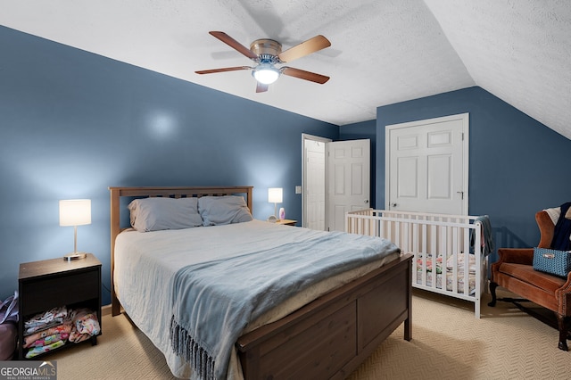 314 Kings Pointe Dr SW, Calhoun, GA 30701 - bedroom featuring ceiling fan, carpet, vaulted ceiling, and a textured ceiling
