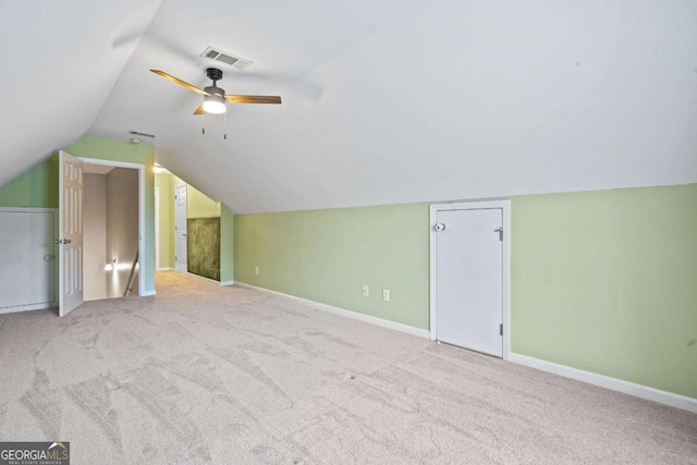additional living space featuring visible vents, a ceiling fan, baseboards, and carpet