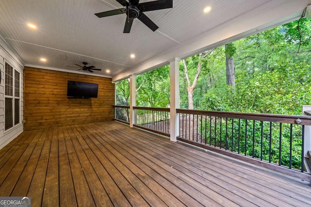 wooden terrace with a ceiling fan