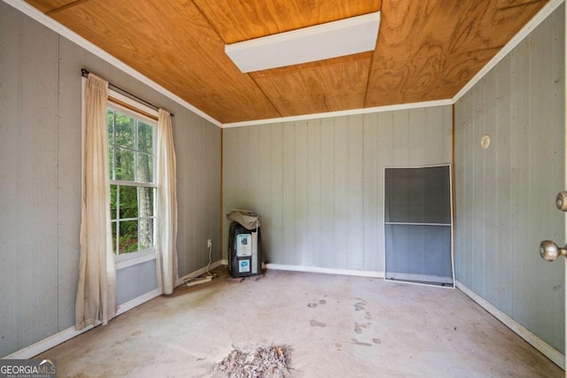 unfurnished room featuring wooden walls, unfinished concrete flooring, and wood ceiling