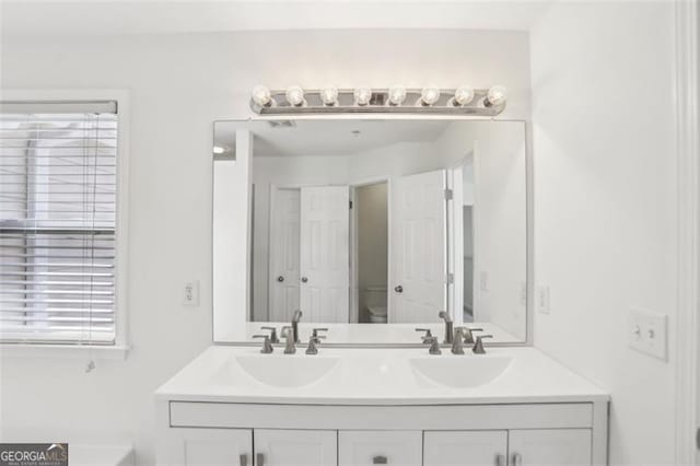 6080 Indian Wood Cir, Mableton, GA 30126 - full bath with a sink, a healthy amount of sunlight, and toilet