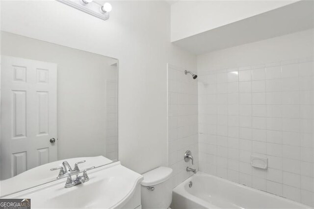 6080 Indian Wood Cir, Mableton, GA 30126 - bathroom featuring a sink, toilet, and shower / washtub combination