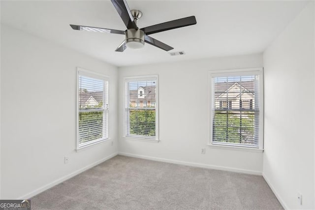 6080 Indian Wood Cir, Mableton, GA 30126 - unfurnished room with baseboards, visible vents, carpet, and a wealth of natural light