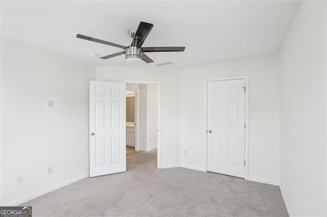 6080 Indian Wood Cir, Mableton, GA 30126 - unfurnished bedroom featuring carpet floors, baseboards, and ceiling fan