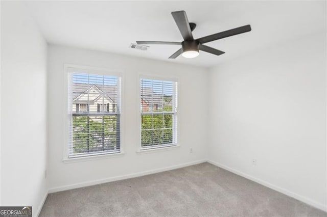 6080 Indian Wood Cir, Mableton, GA 30126 - carpeted spare room with baseboards, a ceiling fan, and visible vents