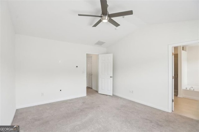 6080 Indian Wood Cir, Mableton, GA 30126 - unfurnished bedroom with carpet flooring, baseboards, visible vents, and lofted ceiling