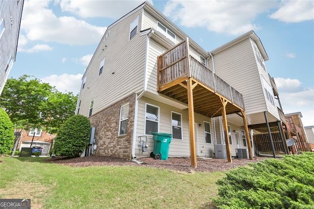 6080 Indian Wood Cir, Mableton, GA 30126 - back of house with a lawn, brick siding, central AC, and a deck