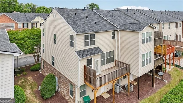 6080 Indian Wood Cir, Mableton, GA 30126 - rear view of house featuring a shingled roof and central AC
