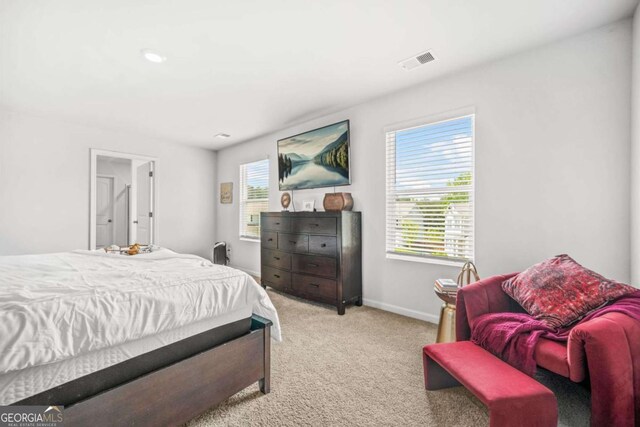 3135 Ellenton Dr, Lithia Springs, GA 30122 - bedroom featuring light colored carpet and baseboards