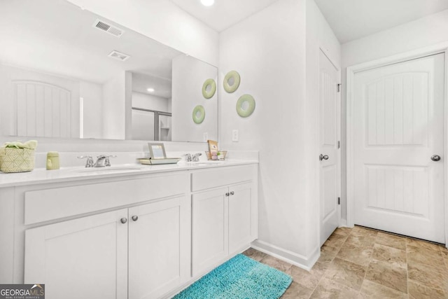 3135 Ellenton Dr, Lithia Springs, GA 30122 - bathroom featuring double vanity and a shower with door