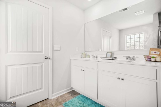 3135 Ellenton Dr, Lithia Springs, GA 30122 - bathroom featuring double vanity and baseboards
