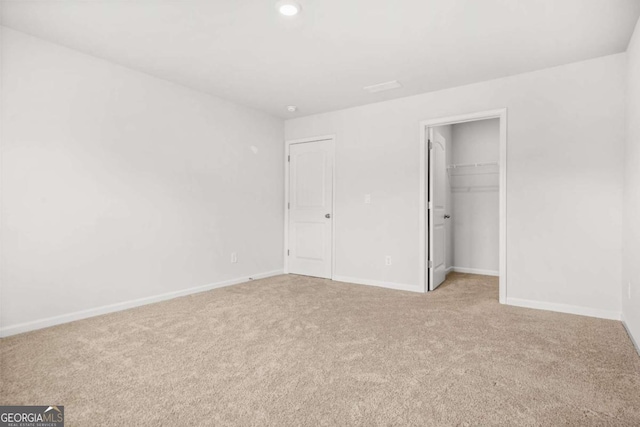 3135 Ellenton Dr, Lithia Springs, GA 30122 - unfurnished bedroom featuring carpet floors, recessed lighting, a spacious closet, and a closet