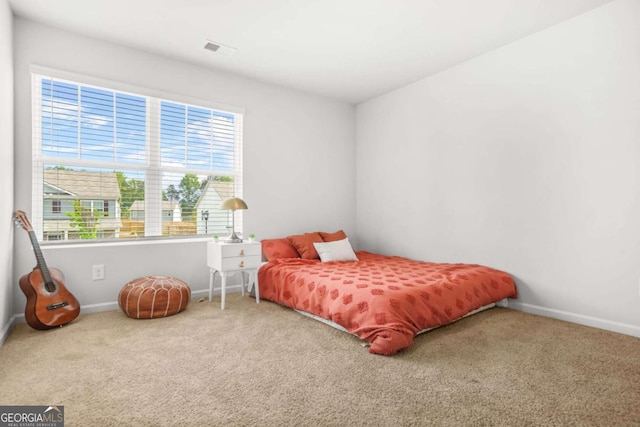 3135 Ellenton Dr, Lithia Springs, GA 30122 - carpeted bedroom with baseboards