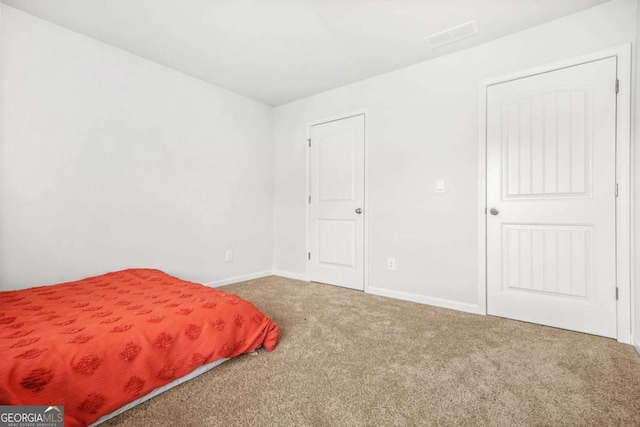 3135 Ellenton Dr, Lithia Springs, GA 30122 - bedroom featuring carpet and baseboards