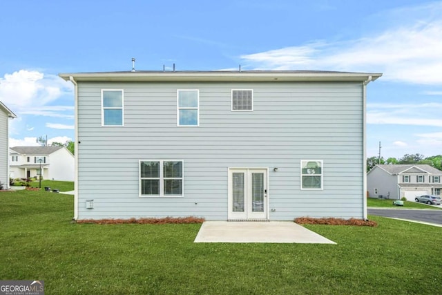 3135 Ellenton Dr, Lithia Springs, GA 30122 - back of house featuring a yard and a patio