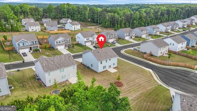 3135 Ellenton Dr, Lithia Springs, GA 30122 - aerial view of residential area with a forest