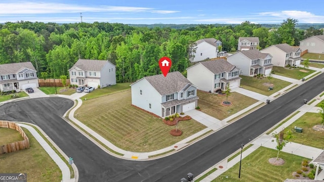3135 Ellenton Dr, Lithia Springs, GA 30122 - aerial perspective of suburban area with a heavily wooded area