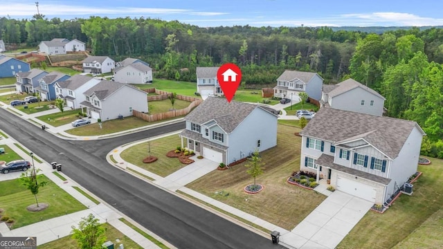 3135 Ellenton Dr, Lithia Springs, GA 30122 - aerial view of residential area featuring a heavily wooded area