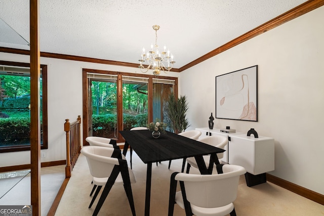 dining area featuring an inviting chandelier, baseboards, ornamental molding, and a textured ceiling