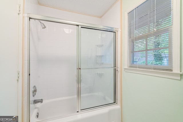 full bathroom featuring combined bath / shower with glass door