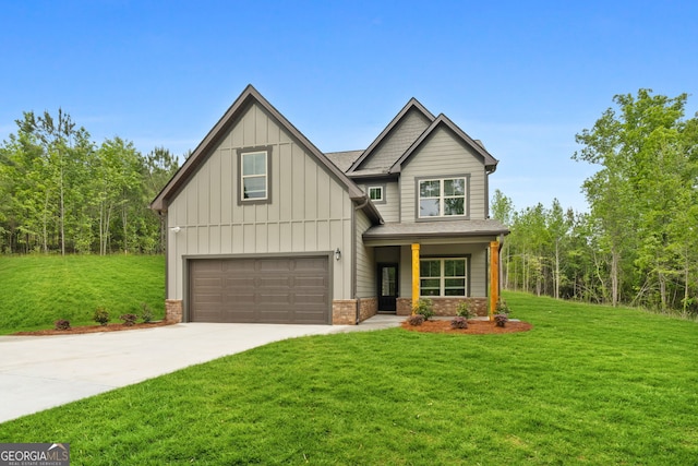 craftsman-style home featuring an attached garage, board and batten siding, concrete driveway, and a front yard