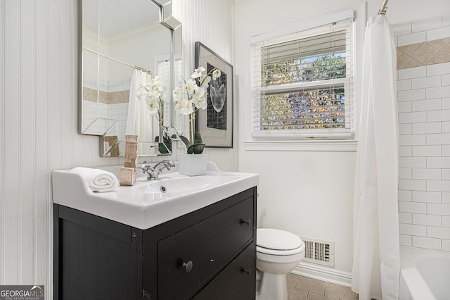 bathroom featuring visible vents, vanity, tile patterned floors, toilet, and ornamental molding