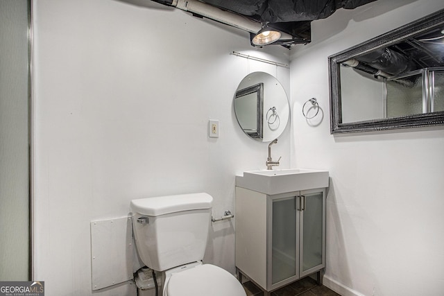 bathroom with toilet and vanity
