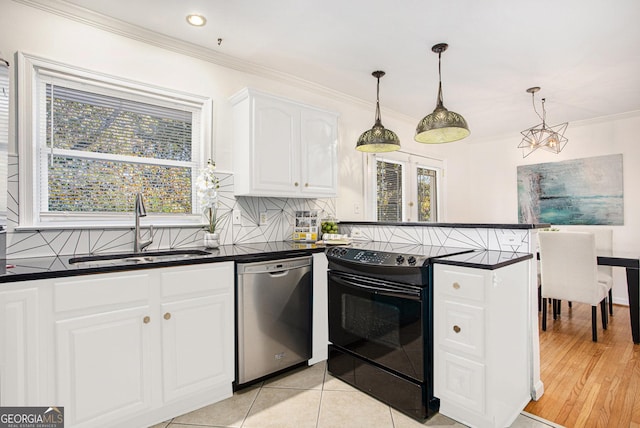 kitchen with dark countertops, a sink, black electric range oven, a peninsula, and stainless steel dishwasher