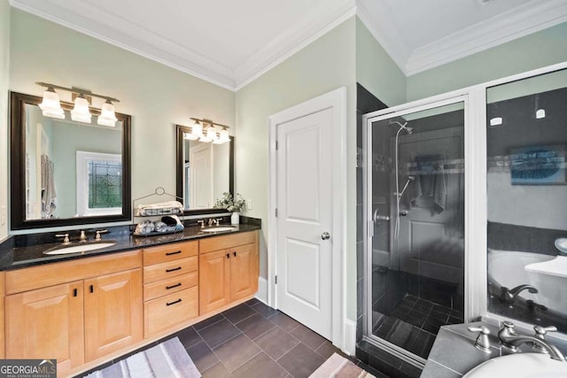full bathroom featuring crown molding, a sink, and a shower stall