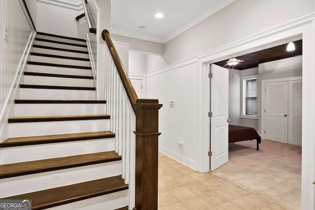 stairway featuring carpet flooring, recessed lighting, and a decorative wall