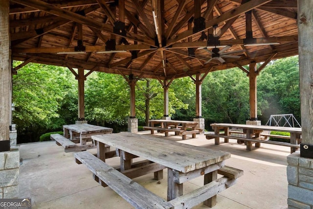 view of home's community featuring a gazebo, outdoor dining area, and a patio area