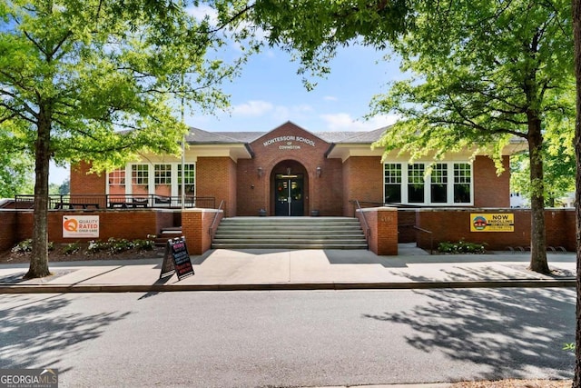 view of front of home with brick siding