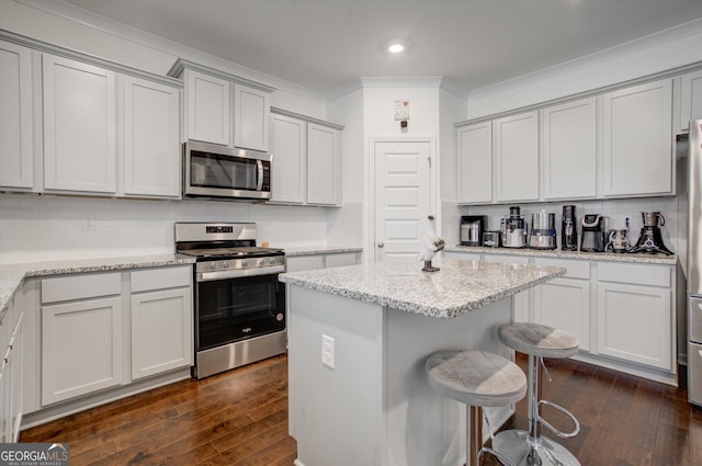 3236 Papyrus Palm Rd, Loganville, GA 30052 - carpeted bedroom with visible vents, crown molding, baseboards, a tray ceiling, and ensuite bath