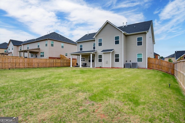 3236 Papyrus Palm Rd, Loganville, GA 30052 - rear view of property featuring a fenced backyard, a lawn, and central AC