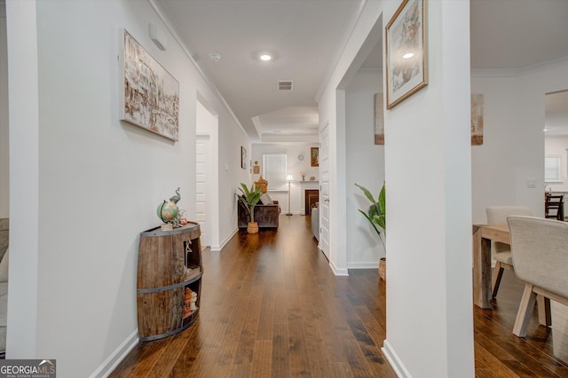 3236 Papyrus Palm Rd, Loganville, GA 30052 - dining room with crown molding, baseboards, dark wood finished floors, and visible vents