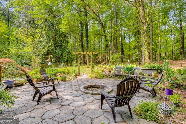view of patio / terrace with an outdoor fire pit