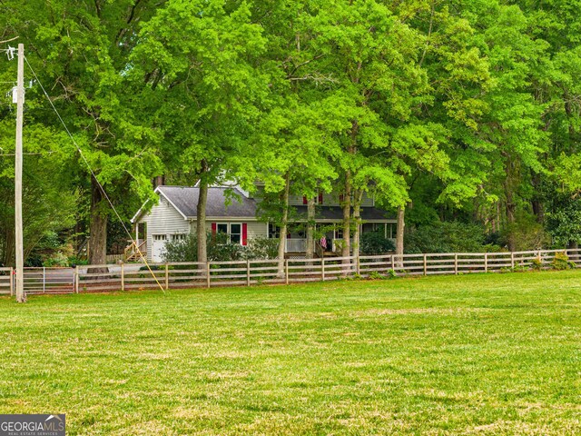 aerial view featuring a wooded view