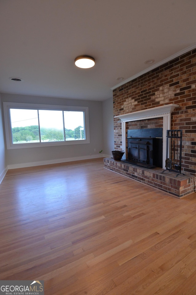 2647 Mount Carmel Rd, Hampton, GA 30228 - unfurnished living room featuring baseboards, wood finished floors, and a wealth of natural light